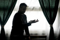 Nurse Osvaldo Negri holds a tarantula, one of his 60 pet spiders in Lanus, Argentina, Thursday, Sept. 9, 2021. The 50-year-old nurse said he began raising spiders to overcome arachnophobia and that caring for them has helped him cope with working at the hospital in the midst of COVID-19, “unplugging” as he watches and sometimes touches the spiders, feeding them cockroaches. (AP Photo/Natacha Pisarenko)