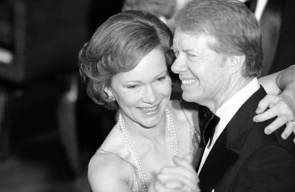 FILE - In this Dec. 13, 1978, file photo, President Jimmy Carter and his wife Rosalynn lead their guests in dancing at the annual Congressional Christmas Ball at the White House in Washington. Jimmy and Rosalynn are celebrating their 77th wedding anniversary, Friday, July 7, 2023. (AP Photo/Ira Schwarz, File)