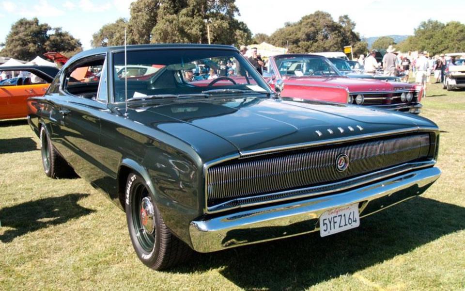 the 1966 dodge charger on grass at car show