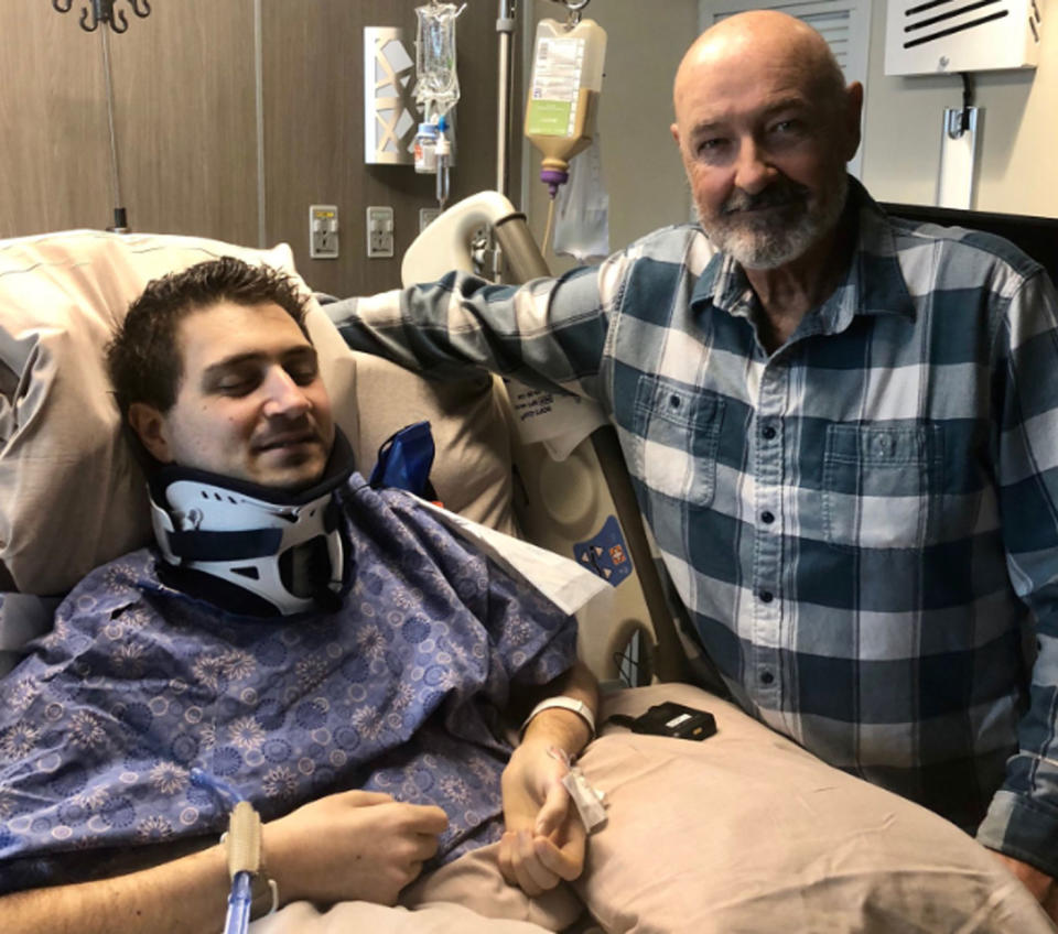 Sydney man Gilbert Sahyoun, 38, has been left quadriplegic after diving into shallow water at Pamlico Sound, North Carolina during a family reunion. He's pictured with Lost actor Terry O'Quinn. Source: Twitter/ Terry O'Quinn