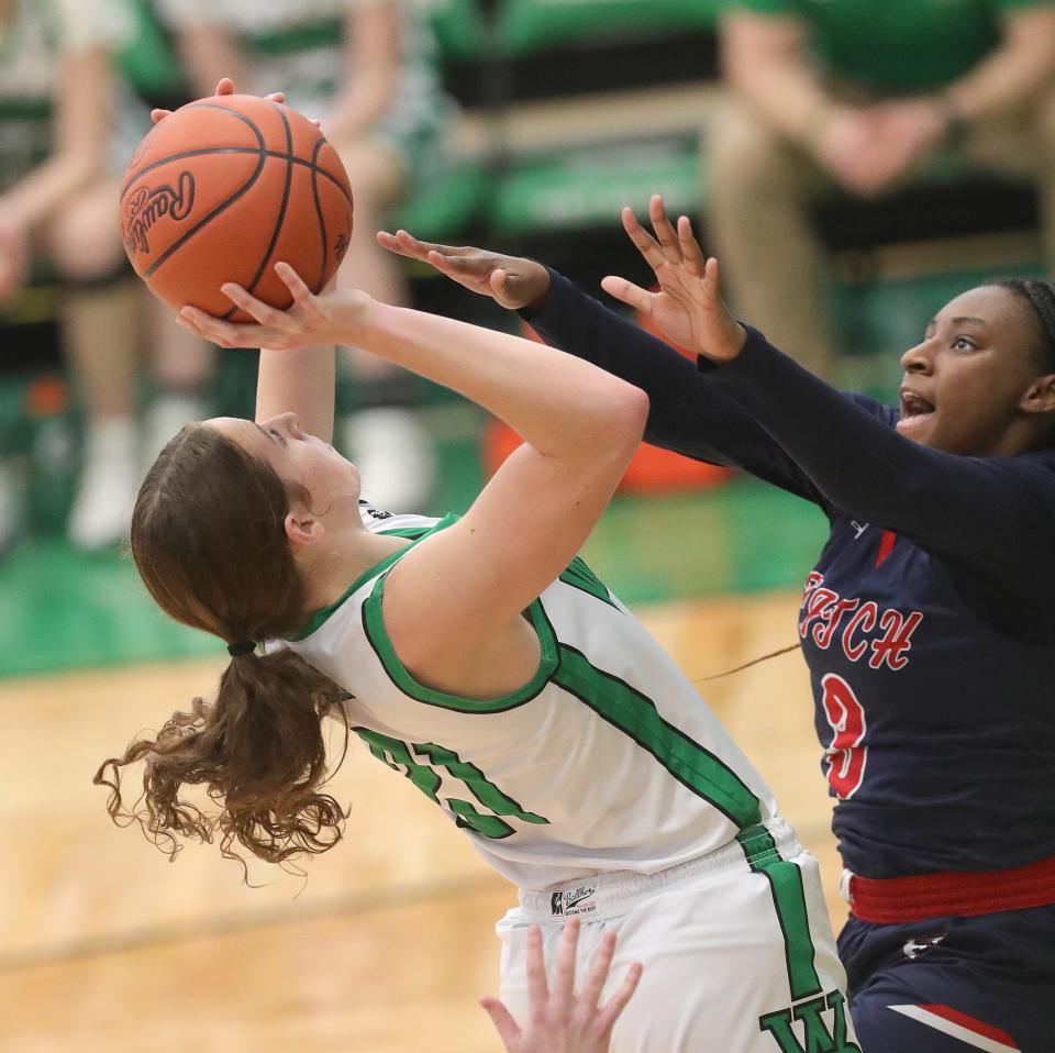 West Branch's Sophie Gregory, left, puts up a shot defended by Fitch's Destanie McCullough, Saturday, Feb. 3, 2024.