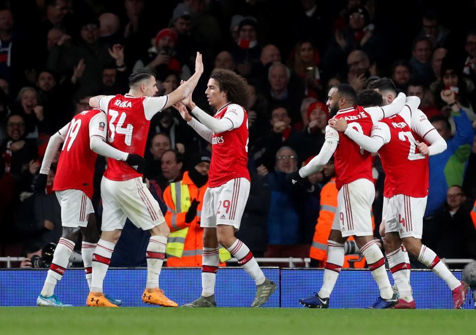 Soccer Football - FA Cup - Third Round - Arsenal v Leeds United - Emirates Stadium, London, Britain - January 6, 2020   Arsenal's Reiss Nelson celebrates scoring their first goal with teammates    Action Images via Reuters/Matthew Childs