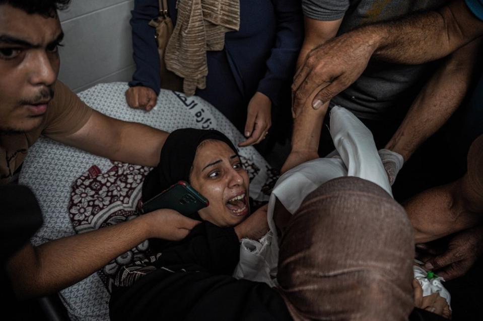 A Palestinian woman mourns her daughter, Mira, who was killed on Oct. 9 following an airstrike.<span class="copyright">Saher Alghorra—Zuma Press</span>