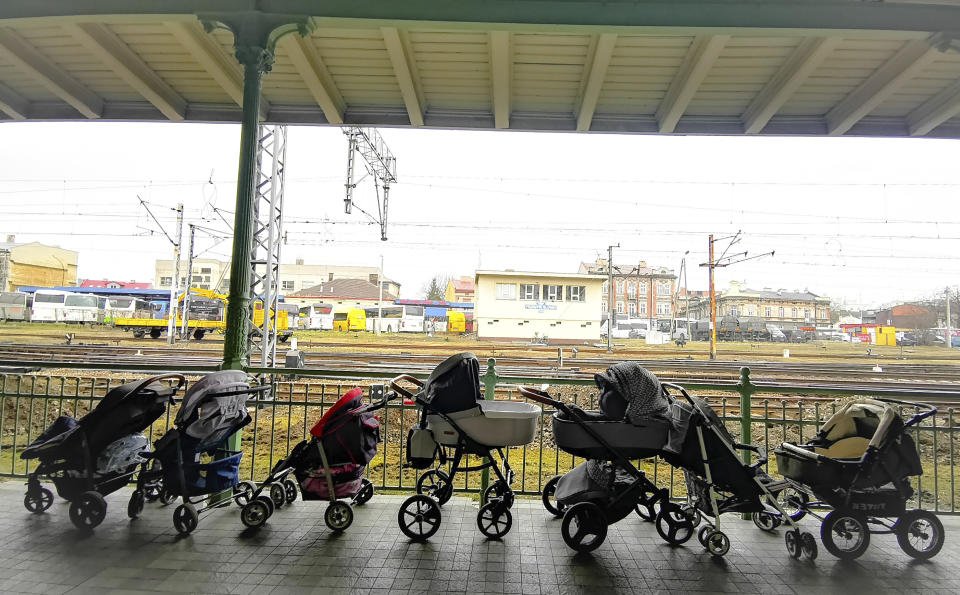 Strollers for refugees and their babies fleeing the conflict from neighbouring Ukraine are left at the train station in Przemysl, at the border crossing in Medyka, Poland, Thursday, March 3, 2022. (AP Photo/Francesco Malavolta)