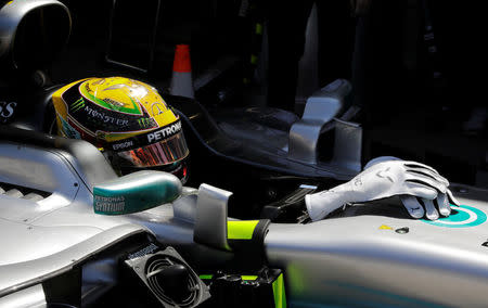 Formula One F1 - Brazilian Grand Prix 2017 - Sao Paulo, Sao Paulo - November 10, 2017. Mercedes' Lewis Hamilton of Britain sits in his car during first practice. REUTERS/Paulo Whitaker