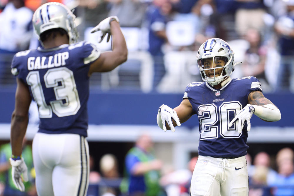 Dallas Cowboys running back Tony Pollard (20) wears a Crucial