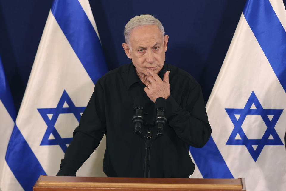 Israeli Prime Minister Benjamin Netanyahu speaks during a press conference with Defense Minister Yoav Gallant and Cabinet Minister Benny Gantz in the Kirya military base in Tel Aviv, Israel, Saturday, Oct. 28, 2023. (Abir Sultan/Pool Photo via AP)