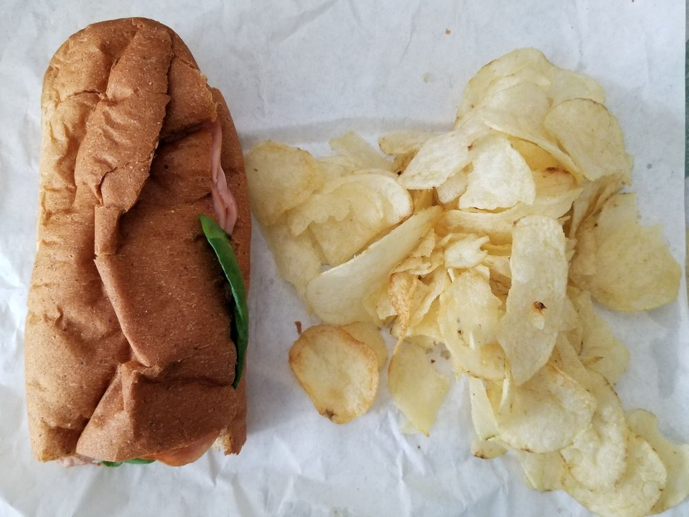 A Subway sandwich and chips