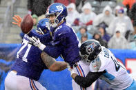 <p>Eli Manning #10 of the New York Giants fumbles the ball as he is wrapped up by Kamalei Correa #44 of the Tennessee Titans during the second half at MetLife Stadium on December 16, 2018 in East Rutherford, New Jersey. (Photo by Steven Ryan/Getty Images) </p>