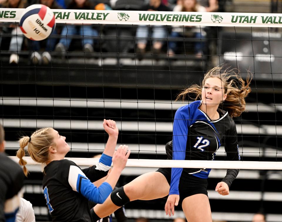 Panguitch’s Tabetha Henrie spikes the ball over Rich’s Aeva Ellsworth as they play for the 1A Volleyball championship at UVU on Saturday, Oct. 28, 2023. | Scott G Winterton, Deseret News