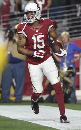 FILE PHOTO: January 16, 2016; Glendale, AZ, USA; Arizona Cardinals wide receiver Michael Floyd (15) celebrates after scoring a touchdown against Green Bay Packers during the second half in a NFC Divisional round playoff game at University of Phoenix Stadium. Mandatory Credit: Kyle Terada-USA TODAY Sports / Reuters Picture Supplied by Action Images (TAGS: Sport American Football NFL) *** Local Caption *** 2016-01-17T041437Z_1545900325_NOCID_RTRMADP_3_NFL-NFC-DIVISIONAL-GREEN-BAY-PACKERS-AT-ARIZONA-CARDINALS.JPG