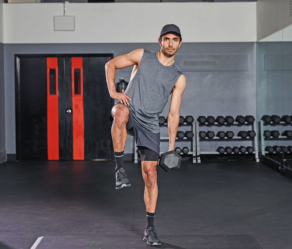 How to do it<ol><li>Stand on left leg with right leg bent at 90 degrees, foot flexed, holding a heavy dumb­bell in left hand.</li><li>Don’t rush: Keep obliques and glutes engaged as you dip toward the left.</li></ol>