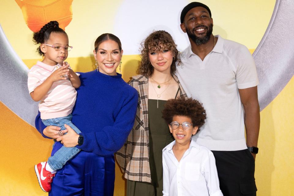 US dancers Allison Holker (2nd L), Stephen "tWitch" Boss (R) and family attend the Fans Premiere of Illumination and Universal Pictures' "Minions: The Rise of Gru" on June 25, 2022, in Hollywood, California.