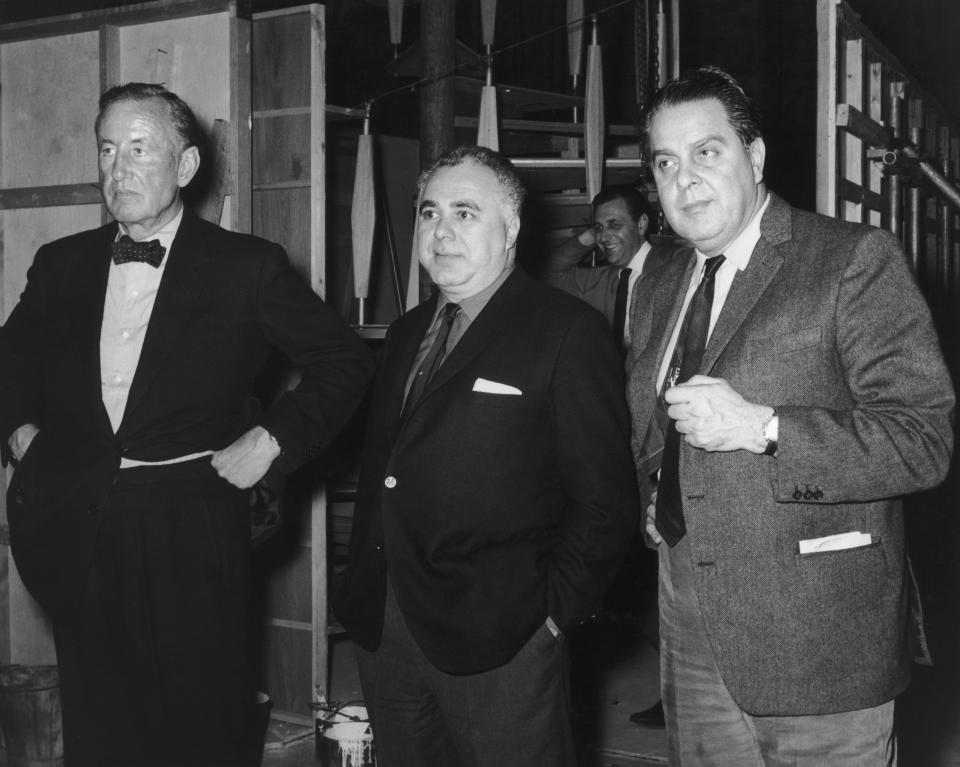 Left to right: British author and creator of James Bond Ian Fleming (1908-1964) with co-producers Harry Saltzman (1915 - 1994) and Albert R. 'Cubby' Broccoli  (1909 - 1996) on the set of 'Goldfinger', directed by Guy Hamilton, 1964. (Photo by Pictorial Parade/Hulton Archive/Getty Images)  