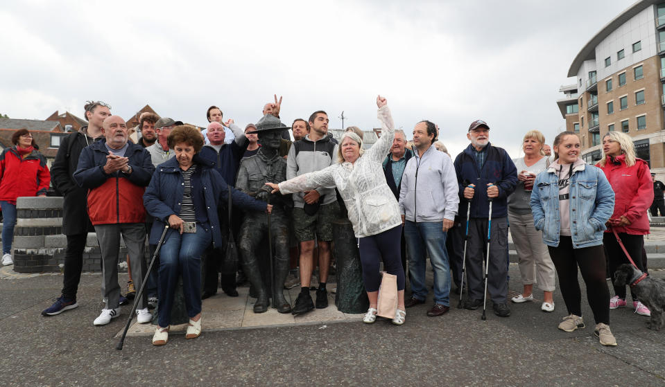 Local residents show their support for a statue of Robert Baden-Powell on Poole Quay in Dorset ahead of its expected removal to "safe storage" following concerns about his actions while in the military and "Nazi sympathies". The action follows a raft of Black Lives Matter protests across the UK, sparked by the death of George Floyd, who was killed on May 25 while in police custody in the US city of Minneapolis.