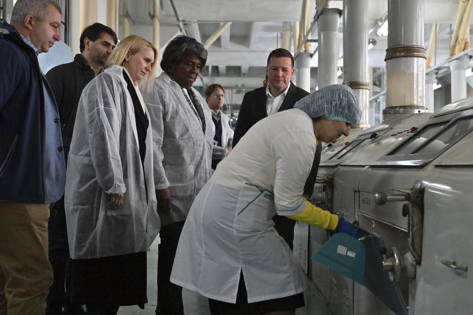 U.S. ambassador to the United Nations, Linda Thomas-Greenfield, center, meets workers during her visit to the Kyiv Mlyn flour mill in Kyiv, Tuesday, Nov. 8, 2022. Thomas-Greenfield, reassured Ukrainian farmers Tuesday that it was a priority for the Secretary General to extend a wartime grain deal that allows Ukrainian grain and other commodities to be shipped to world markets. (Sergei Supinsky, Pool Photo via AP)