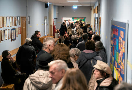 People are queueing to cast their votes during the Polish regional elections, at a polling station in Warsaw, Poland, October 21, 2018. Maciek Jazwiecki/Agencja Gazeta via REUTERS