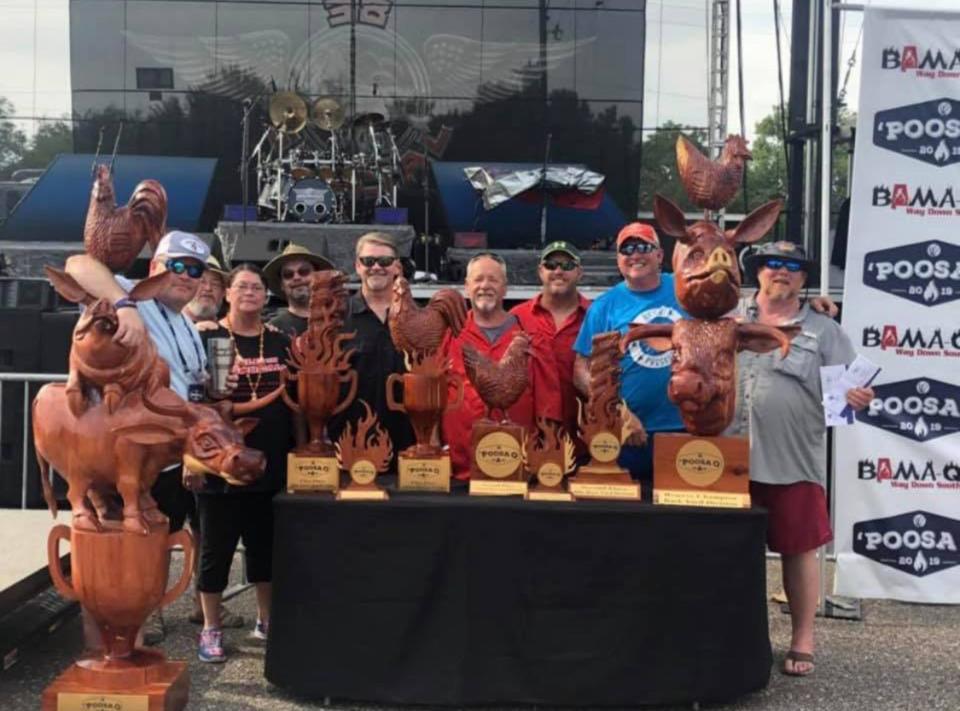 Tim Evans, left, with some of his 256 BBQ buddies and their trophies at the 2019 'Poosa Q at Wind Creek Montgomery.