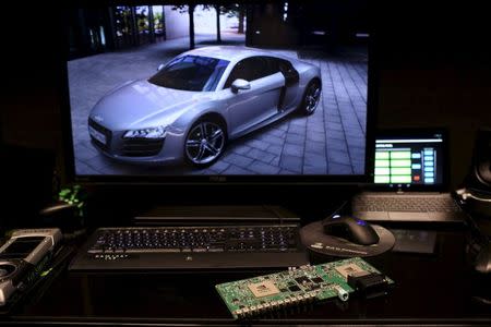 Electronic dashboard components are shown at a graphic display of an Audi automobile in Santa Clara, California in this February 11, 2015 file photo. REUTERS/Robert Galbraith