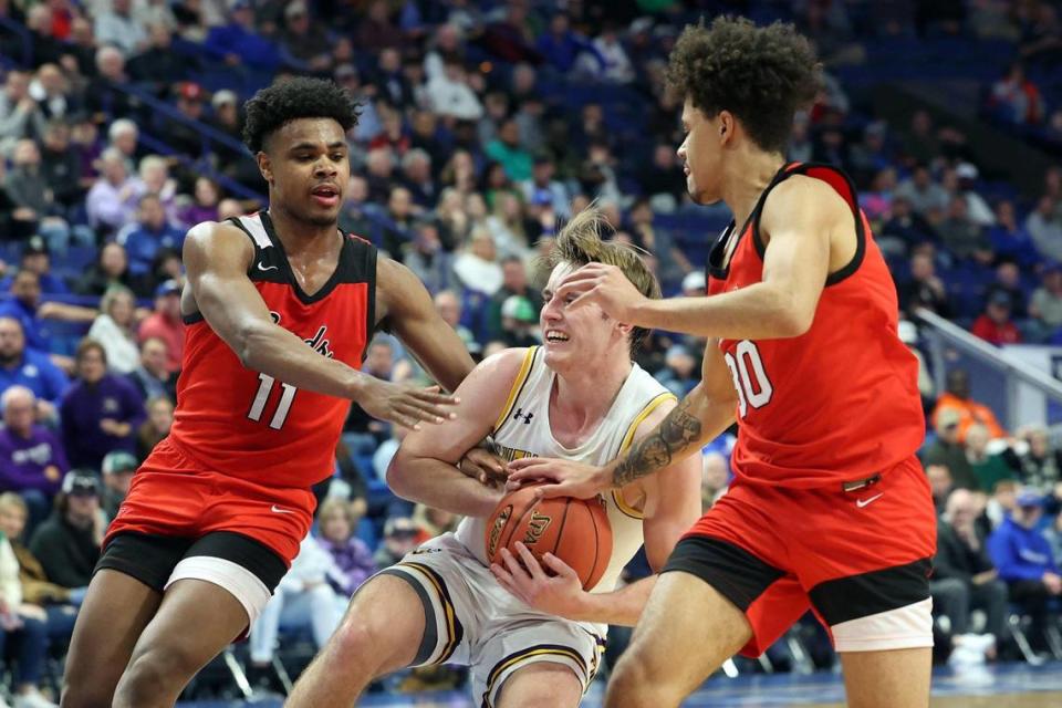 Lyon County’s Travis Perry looks for a crack in the George Rogers Clark defense during Friday night’s game in Rupp Arena. Perry was held to 19 points, 13 below his average.
