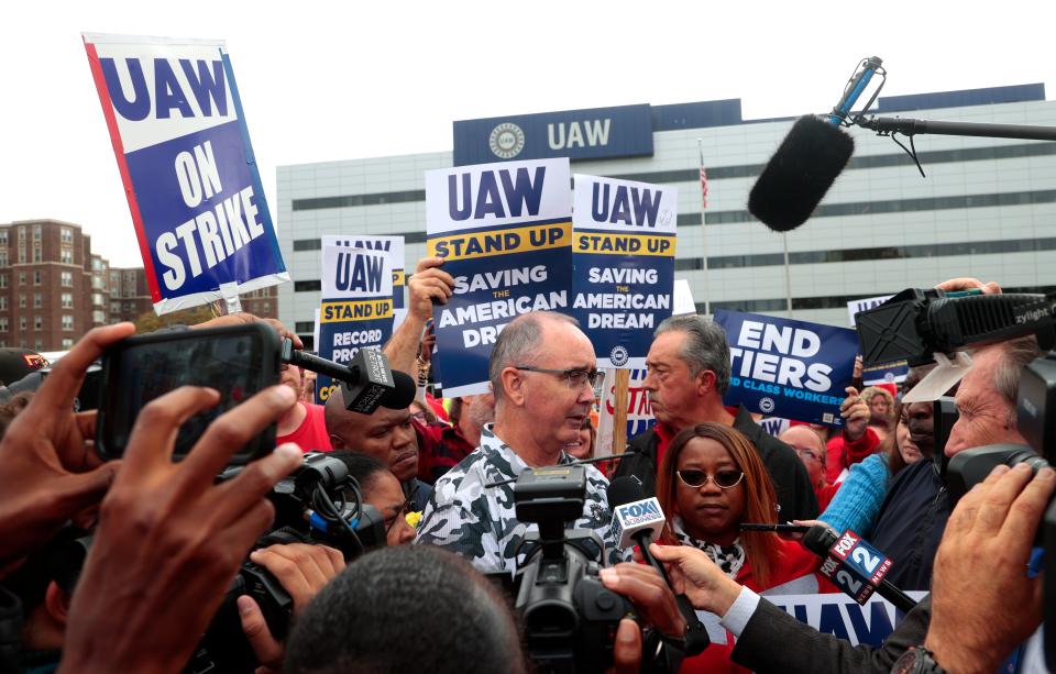 UAW President Shawn Fain talks with the media after his speech from the bed of a Ford F-150 to striking workers, many of whom caravanned in Ford Broncos and Jeeps to hear him at the UAW Solidarity House on Jefferson Avenue in Detroit on Friday, Sept. 29, 2023.