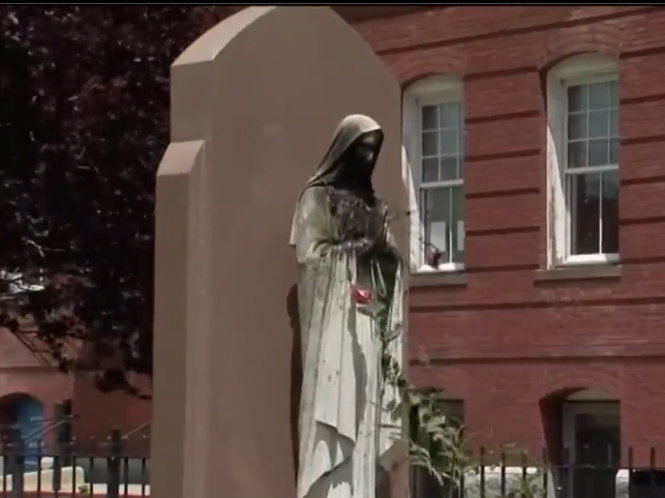 The vandalised statue of the Virgin Mary outside the Saint Peter's Parish church in Dorchester, Boston: (NBC10)