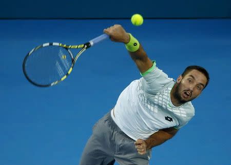 Viktor Troicki of Serbia serves to Mikhail Kukushkin of Kazakhstan during their men's singles final match at the Sydney International tennis tournament in Sydney, January 17, 2015. REUTERS/Jason Reed