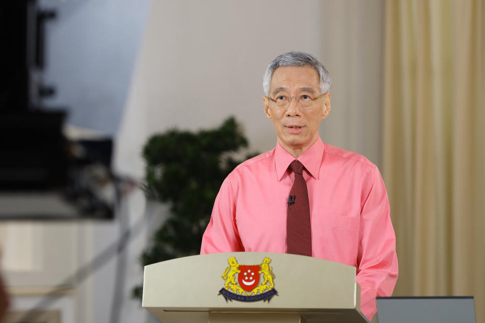In this photo provided by Singapore Ministry of Communications and Information on Tuesday, June 23, 2020, Singapore Prime Minister Lee Hsien Loong makes an announcement about general elections in Singapore. Lee called for early elections to seek a fresh mandate despite the coronavirus pandemic. (Singapore Ministry of Communications and Information via AP)