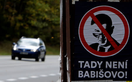 A poster depicting the leader of ANO party Andrej Babis hangs on a bus stop near the town of Benesov, Czech Republic October 11, 2017. REUTERS/David W Cerny