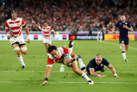 Japan ran out 28 - 21 winners on the way to topping their group. Here, Stu Forster (Getty Images) captures Yu Tamura running in Japan’s third try. He says: “I used my EF 70-200mm f/2.8L IS III USM as he approached to touch down. I shot the photograph wide.”