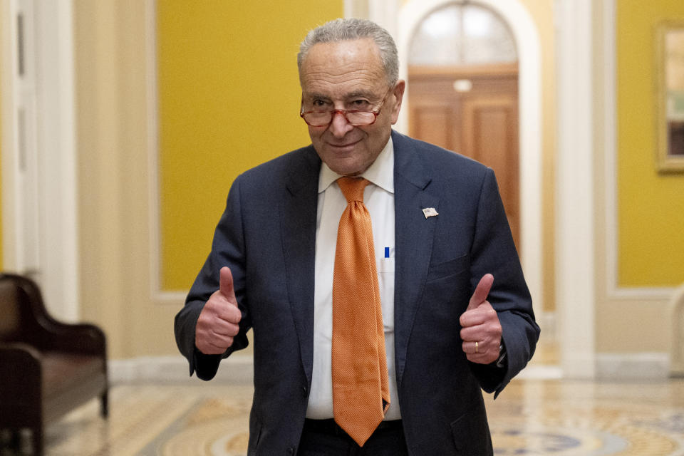 FILE - Senate Majority Leader Chuck Schumer, D-N.Y., gives two thumbs up as the Senate votes to approve a 45-day funding bill to keep federal agencies open, Saturday, Sept. 30, 2023, in Washington. (AP Photo/Andrew Harnik, File)