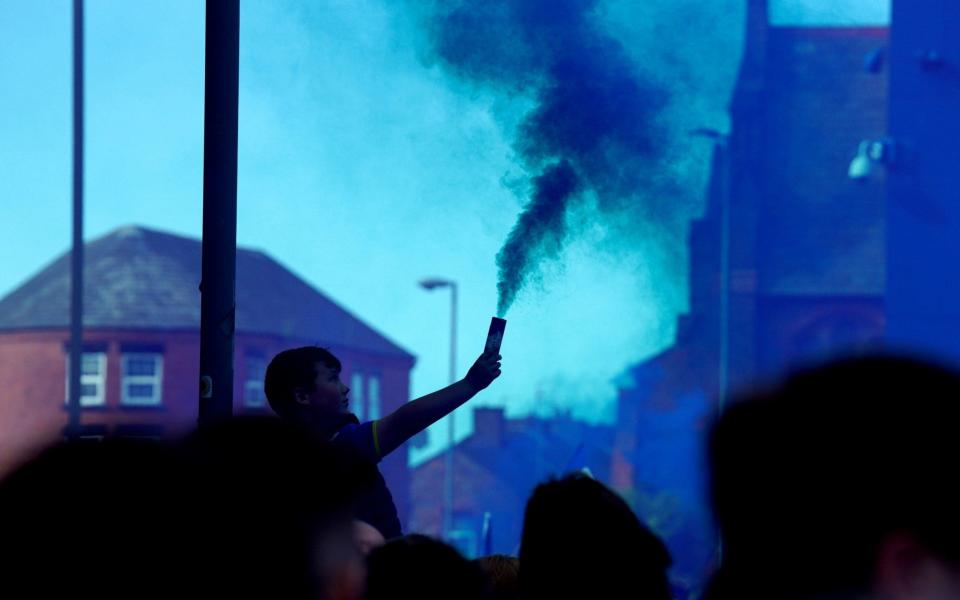 Blue smoke fills the air outside the stadium - PA