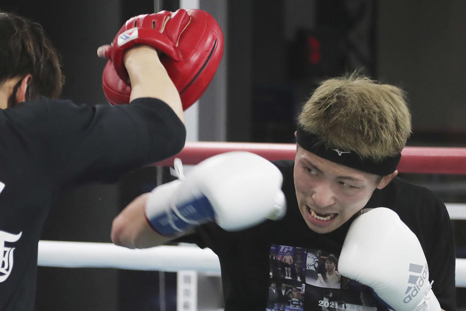 Japanese boxer and the WBA and IBF bantamweight world champion Naoya Inoue trains at the Ohashi Boxing Gym in Yokohama, near Tokyo on Nov. 23, 2021. Drawing praise as one of the best "pound for pound" active boxers around, and the best out of Asia since the legendary Manny Pacquiao, Inoue now has his eyes on the big money and American stardom. (AP Photo/Koji Sasahara)