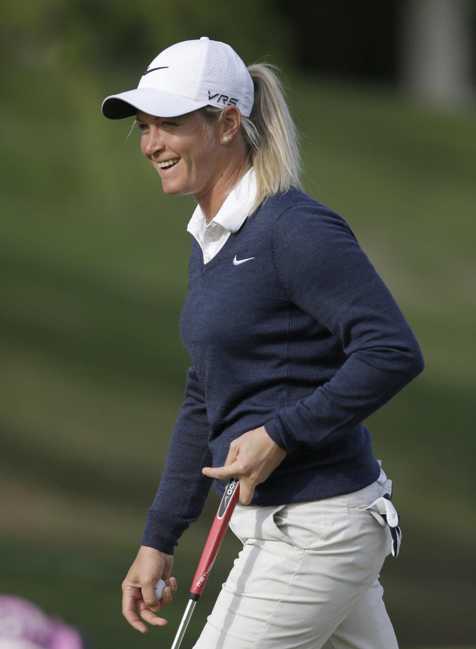 Suzann Pettersen, of Norway, smiles after putting on the eighth hole during the first round of the North Texas LPGA Shootout golf tournament at the Las Colinas Country Club in Irving, Texas, Thursday, May 1, 2014. (AP Photo/LM Otero)