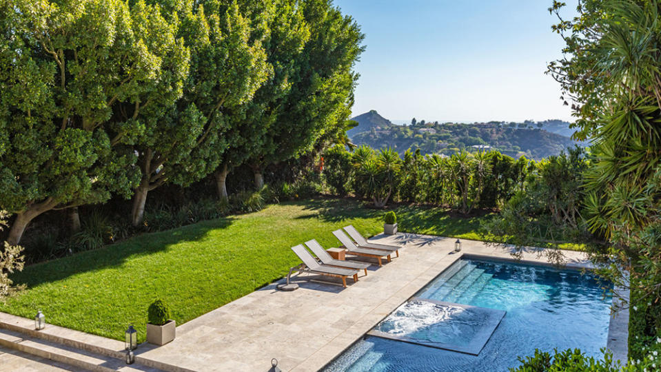 The expansive backyard with scenic views. - Credit: Redfin