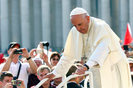 Pope Francis arrives to lead the weekly audience at the Vatican, September 14, 2016. REUTERS/Alessandro Bianchi