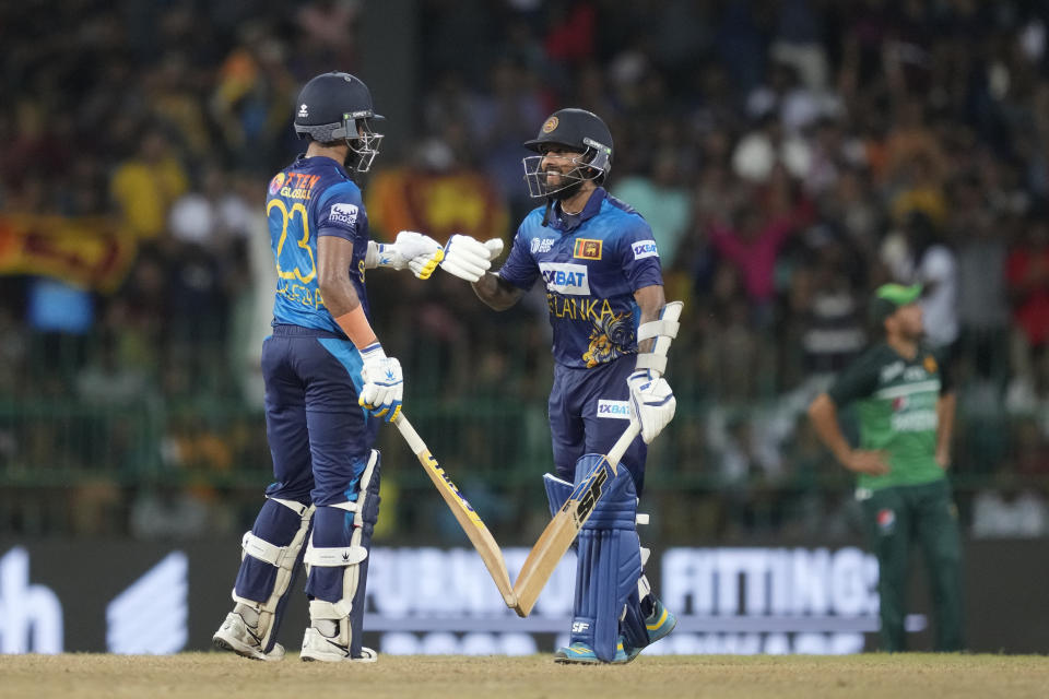 Sri Lanka's Sadeera Samarawickrama and Kusal Mendis celebrate hundred runs partnership during the Asia Cup cricket match between Pakistan and Sri Lanka in Colombo, Sri Lanka on Thursday, Sept.14, 2023. (AP Photo/Eranga Jayawardena)