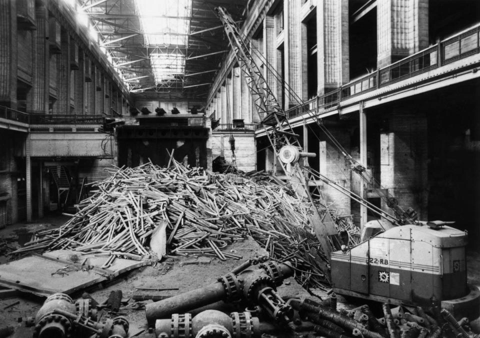 Battersea: 9th July 1981:  A crane fitted with a huge magnet clears metallic debris from the 'A' turbine hall of Battersea Power Station, London. The landmark building, designed by Sir Giles Gilbert Scott is gradually being closed down and gutted.  (Photo by Ian Tyas/Keystone Features/Getty Images) (Getty Images)