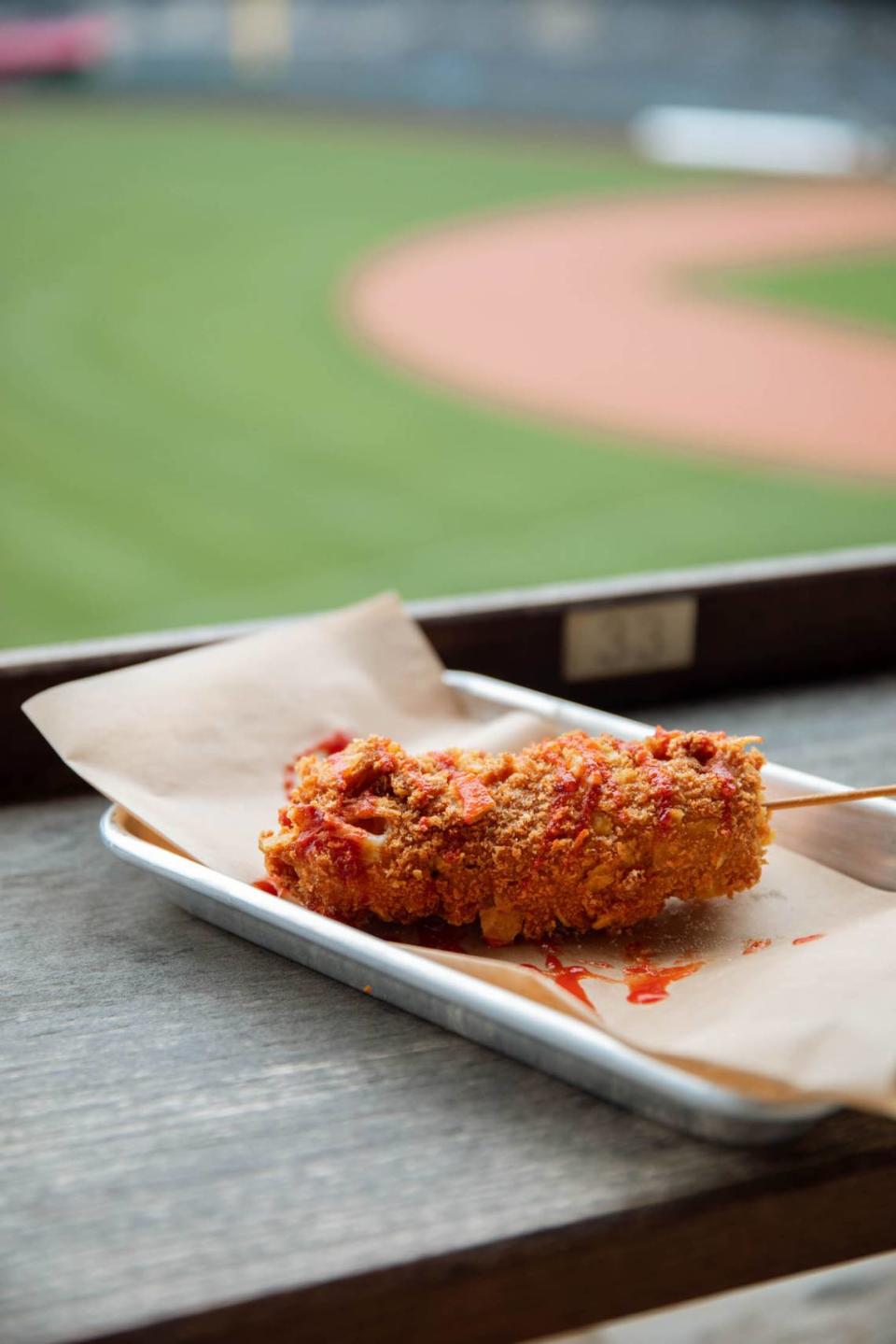 A Korean corn dog — prepared in a panko and corn chips mix, served with sriracha ketchup — will be offered at Craft & Draft in Section 301.