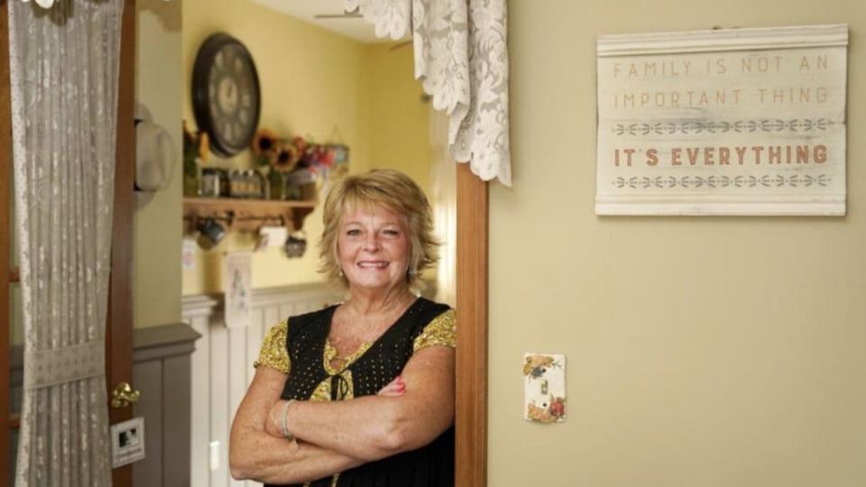 Kay Orzechowicz poses Wednesday, Sept. 2, 2020, for a portrait at her Griffith, Ind., home. After 35 years of teaching, Orzechowicz said COVID-19 “pushed her over the edge” to retire from northwest Indiana’s Griffith High School at the end of July. (AP Photo/Charles Rex Arbogast)