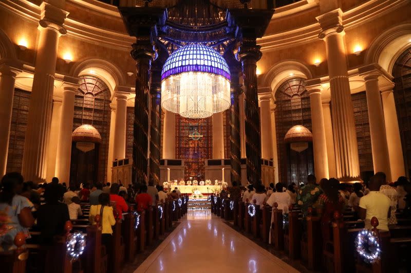 Worshippers attend the celebration of Christmas at the Basilica Notre Dame in Yamoussoukro