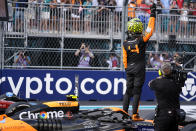 McLaren driver Lando Norris, of Britain, waves to the crowd after winning the Miami Formula One Grand Prix auto race Sunday, May 5, 2024, in Miami Gardens, Fla. (AP Photo/Rebecca Blackwell)