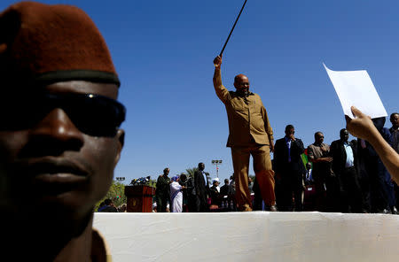 FILE PHOTO: Sudan's President Omar al-Bashir waves to his supporters during a rally at the Green Square in Khartoum, Sudan January 9, 2019. REUTERS/Mohamed Nureldin Abdallah/File Photo