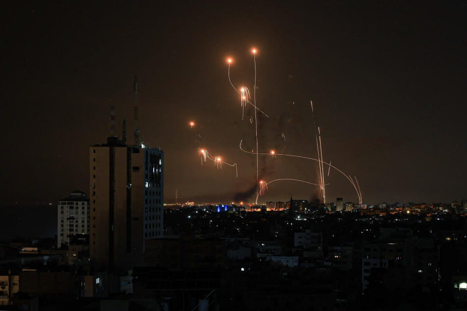 An Israeli missile launched from an Iron Dome system attempts to intercept a rocket (Mahmud Hams / AFP via Getty Images)