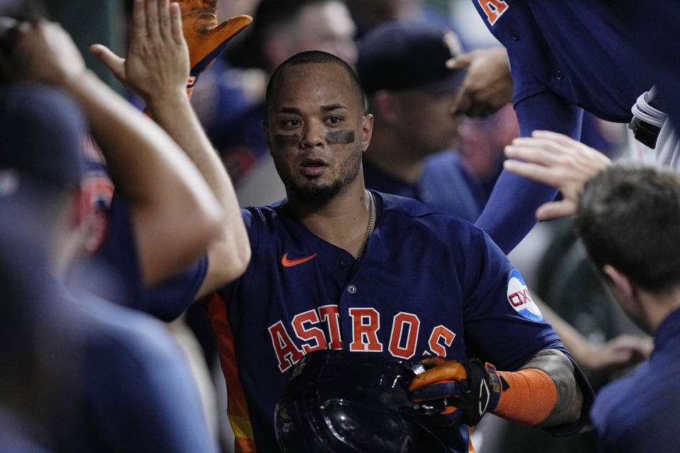 Houston Astros' Martin Maldonado is congratulated in the dugout after his home run against the Seattle Mariners during the eighth inning of a baseball game Saturday, July 8, 2023, in Houston. (AP Photo/Kevin M. Cox)