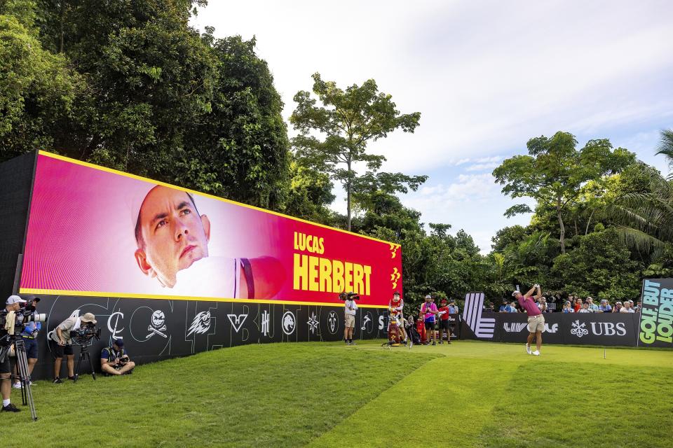 Lucas Herbert, of Ripper GC, hits his shot from the first tee during the final round of LIV Golf Singapore at Sentosa Golf Club on Sunday, May 5, 2024, in Sentosa, Singapore. (LIV Golf via AP)