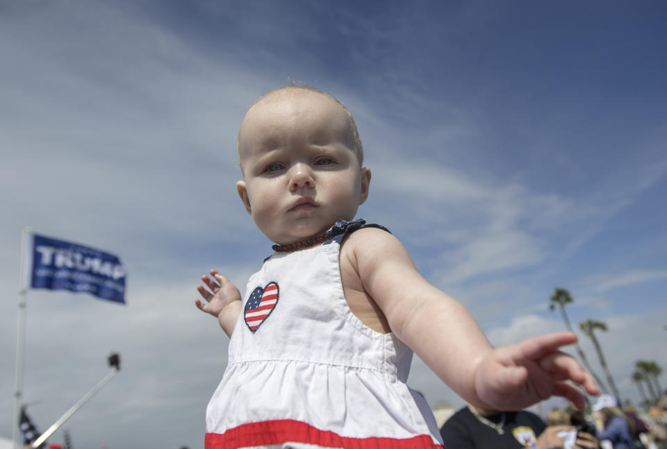 Eva Erbacker wears patriotic colors at a rally in support of President Donald Trump in Huntington Beach, Calif., on Saturday, March 25, 2017. A march after the rally turned violent when pro-Trump and anti-Trump protesters clashed. (Mindy Schauer/The Orange County Register via AP)