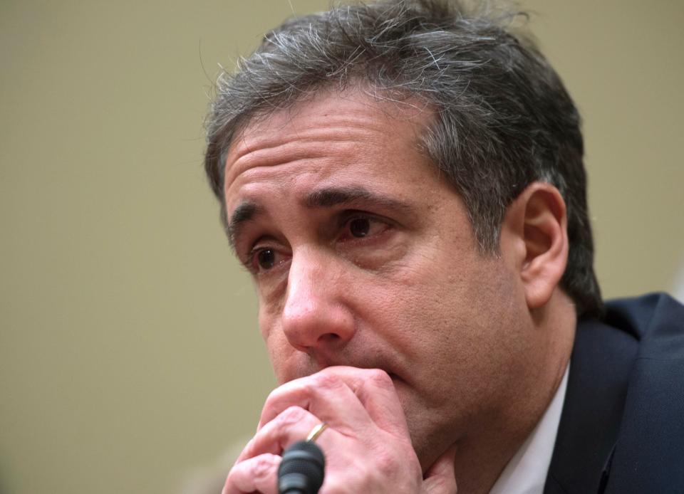 Michael Cohen, Donald Trump's former personal lawyer, tears up after testifying to the House Oversight Committee about the crimes he committed on behalf of and at the direction of the president. (Photo: ANDREW CABALLERO-REYNOLDS via Getty Images)