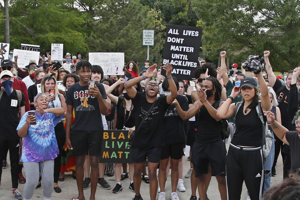Black Lives Matter demonstrators chant outside the Norman Police Department on June 2. (Sue Ogrocki / AP)