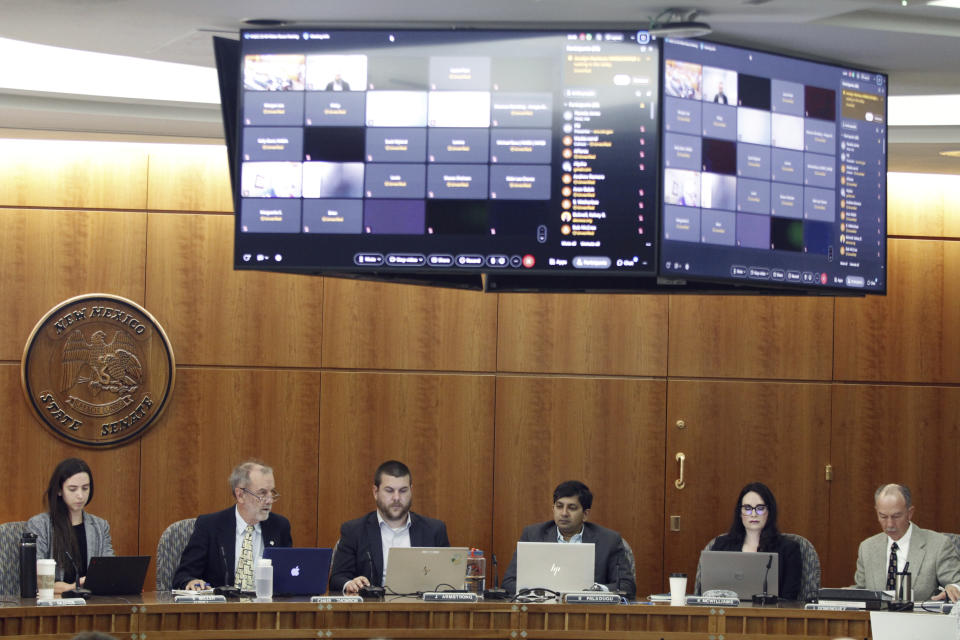 Members of the New Mexico Water Quality Control Commission, including Chairman Bruce Thomson, second from left, gather in Santa Fe, N.M., Monday, May 13, 2024. Environmental officials in the nation's No. 2 state for petroleum production are taking initial steps toward regulating the treatment and reuse of oil-industry fracking water. New Mexico has been grappling with scarce water supplies, and fossil fuel producers are confronting shrinking opportunities for water disposal. (AP Photo/Morgan Lee)